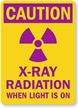 Caution: X-Ray Radiation When Light Is On Sign