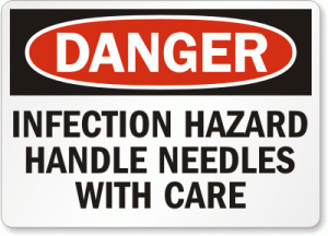 sign warning of the infection hazard of needles