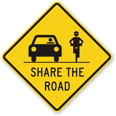 Share the road bikes and cars sign