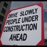 Drive slowly people under construction ahead