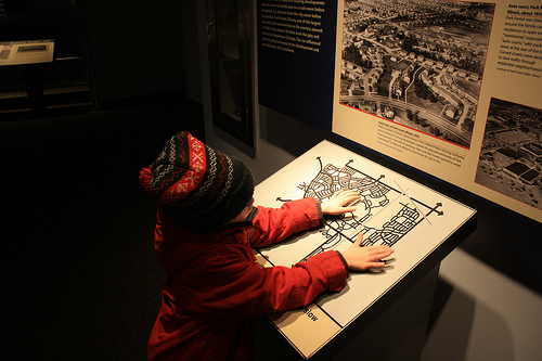 child reading a tactile map