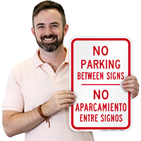 Bilingual No Parking Between Signs