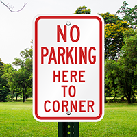 No Parking Here Corner Sign