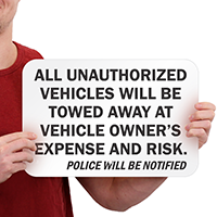 All Unauthorized Vehicles Towed Sign