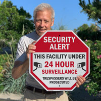 Security Alert This facility under 24hrs surveillance sign