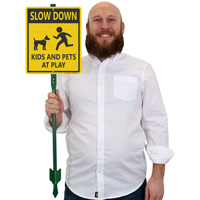 Slow Down Kids And Pets At Play Sign